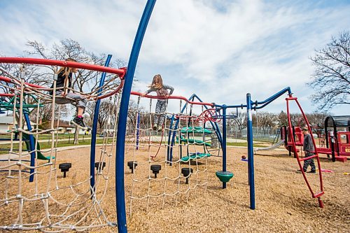 MIKAELA MACKENZIE / WINNIPEG FREE PRESS

Mazi Quinn (eight, left) and Anni Quinn (six, centre) play on a newly re-opened playground at the Riverview Community Centre in Winnipeg on Monday, May 4, 2020. For JS story.

Winnipeg Free Press 2020