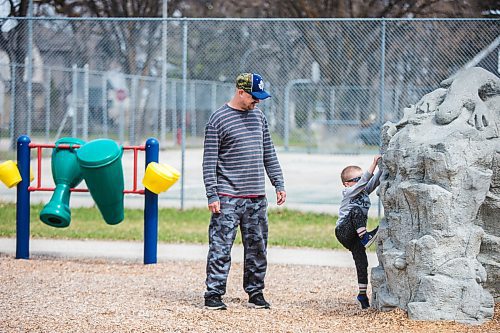 MIKAELA MACKENZIE / WINNIPEG FREE PRESS

John Quinn watches as his four-year-old son, Wade, plays on the newly re-opened playground at the Riverview Community Centre in Winnipeg on Monday, May 4, 2020. For JS story.

Winnipeg Free Press 2020