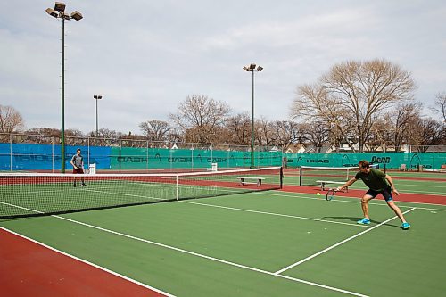 MIKE DEAL / WINNIPEG FREE PRESS
Tennis players Kevin Kylar (left) and Evan Mancer (right) are happy to finally get a chance to knock the ball around at the Sargent Park Tennis Courts Monday afternoon.
See Taylor Allen story
200504 - Monday, May 04, 2020.