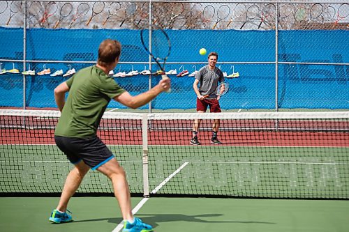 MIKE DEAL / WINNIPEG FREE PRESS
Tennis players Kevin Kylar (right) and Evan Mancer (left) are happy to finally get a chance to knock the ball around at the Sargent Park Tennis Courts Monday afternoon.
See Taylor Allen story
200504 - Monday, May 04, 2020.