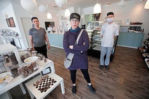 JOHN WOODS / WINNIPEG FREE PRESS
Constance Menzies, centre, owner of Chocolatier Constance Popp, is photographed at her St Boniface chocolate shop with staff members Ray Tara, left, and Paul Lorteau in Winnipeg Monday, May 4, 2020. Menzies is worried her shop will not survive the economic fallout of COVID-19 and has launched a social funding (GoFundMe) page.

Reporter: Speirs