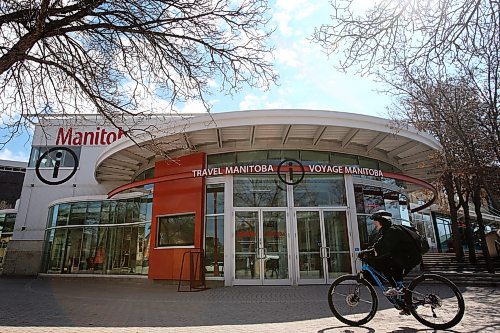 SHANNON VANRAES / WINNIPEG FREE PRESS
A cyclist passes Travel Manitoba's visitor information centre at The Forks on May 6, 2020.