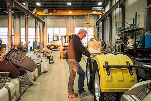 MIKAELA MACKENZIE / WINNIPEG FREE PRESS

Trucker Alain Blair checks his truck before going out on the first job of the day at Trappers Transport in Winnipeg on Wednesday, May 6, 2020. For Dean story.

Winnipeg Free Press 2020