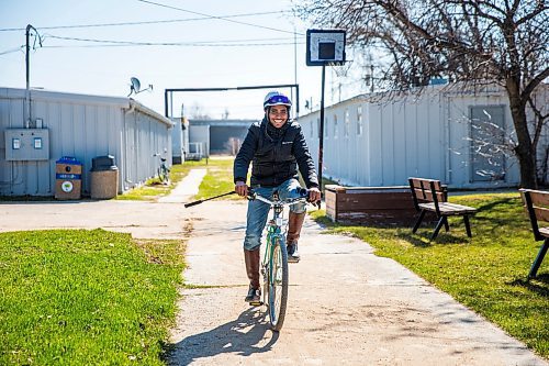 MIKAELA MACKENZIE / WINNIPEG FREE PRESS

Jockey Stanley Chadee rides up to the office at the Assiniboia Downs in Winnipeg on Wednesday, May 6, 2020. For Mike S story.

Winnipeg Free Press 2020