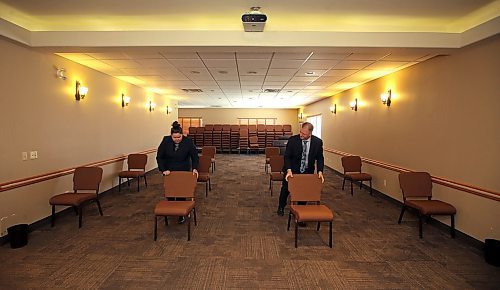 JASON HALSTEAD / WINNIPEG FREE PRESS

Staff members Danielle Froese (left) and Jotham Koslowsky (both licensed funeral directors and embalmers) prepare the chapel at Friends Funeral Chapel on May 6, 2020 for a socially-distanced funeral service. (See Sarah Lawrynuik COVID-19 24-hour story)