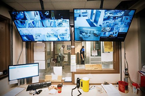 JOHN WOODS / WINNIPEG FREE PRESS
Contracted security officer Oliver Muswagon, right, and staff member Charles respond to a person knocking on the door at the Salvation Army in Winnipeg Wednesday, May 6, 2020. 

Reporter: Thorpe/Part of 24 hr life during COVID-19 project