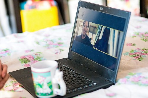 MIKAELA MACKENZIE / WINNIPEG FREE PRESS

Leah Borchert goes on a digital first date with Eddie in her bedroom in Winnipeg on Wednesday, May 6, 2020. For Frances story.

Winnipeg Free Press 2020