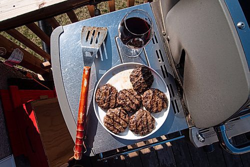 Mike Sudoma / Winnipeg Free Press
Freshly grilled burgers and a glass of red wine, one of Tony Sheas favourite combinations.
May 6, 2020