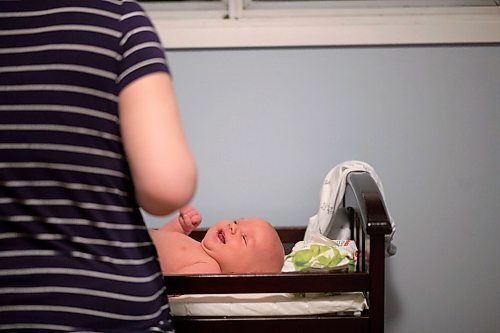 MIKAELA MACKENZIE / WINNIPEG FREE PRESS

Dawn McDonald gets her six-week-old, Henry Sulkers, into his pyjamas in Winnipeg on Wednesday, May 6, 2020. For Leesa story.

Winnipeg Free Press 2020