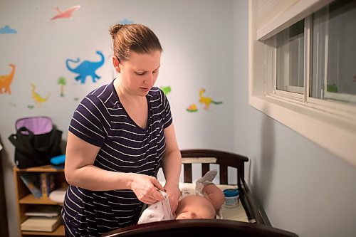 MIKAELA MACKENZIE / WINNIPEG FREE PRESS

Dawn McDonald gets her six-week-old, Henry Sulkers, into his pyjamas in Winnipeg on Wednesday, May 6, 2020. For Leesa story.

Winnipeg Free Press 2020