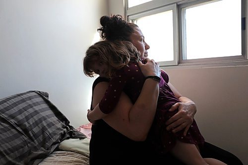 RUTH BONNEVILLE / WINNIPEG FREE PRESS


24 hour project - Women's Shelter 
4 - 5pm
Krystle and her daughter share a hug while in their room at the Women's shelter on Wednesday.  Her daughter looks out the window often asking her mom when they can go outside and play again.  

Story: How has work at the womens shelter changed since the pandemic began? Touring shelter and interview with executive director, Marcie Wood.


 See JS Rutgers story. 

May 6th,  2020