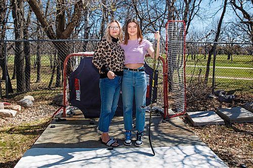 MIKE DEAL / WINNIPEG FREE PRESS
Carrie Patrick and her daughter Aimee who is a hockey player in their backyard practice space.
See Taylor Allen feature
200507 - Thursday, May 07, 2020.