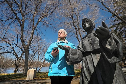 RUTH BONNEVILLE / WINNIPEG FREE PRESS

FAITH -  Grey Nuns Compassionate hotline

Sister Jo-Ann Duggan, a Grey Nun, is part of a group of Catholic nuns who are running a compassionate listening hotline through their cell phones offering a listening ear and prayer for people feeling isolated, fearful or just needing someone to talk to due to the pandemic. 
Sister Duggan stands next to a statue of Saint Marguerite d'Youville who symbolizes the work of the Grey Nuns who have helped the needy for over 175 years in Manitoba.  

Reporter: Brenda Suderman.

May 8th,  2020
