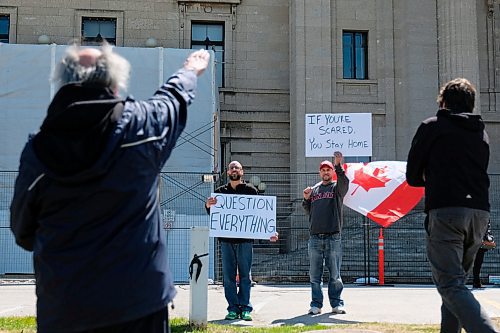 Daniel Crump / Winnipeg Free Press. An unidentified man throws a nazi salute during an anti-lockdown rally at the Manitoba Legislature. The event was hosted by a group called Winnipeg Aware People with a Passion for the Truth. May 9, 2020.