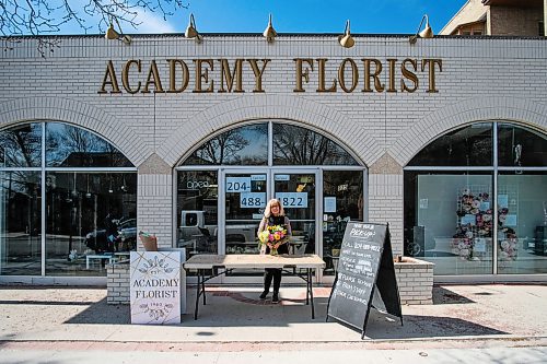 Daniel Crump / Winnipeg Free Press.  Irene Seaman, owner of Academy Florist, stands for a photos outside her Corydon Avenue shop. Seamens team of florists is busy filling orders for mothers day. May 9, 2020.