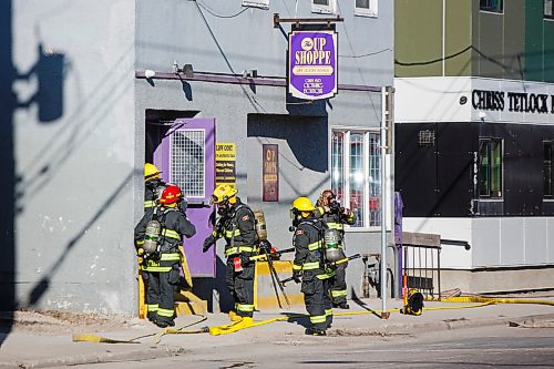 MIKE DEAL / WINNIPEG FREE PRESS
Winnipeg Fire Paramedic Service crews head into 382 Selkirk, a two-story building in which the Up Shoppe, a thrift store, is located, after a report of smoke around 8:30 Monday morning. 

200511 - Monday, May 11, 2020.