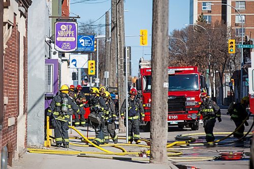 MIKE DEAL / WINNIPEG FREE PRESS
Winnipeg Fire Paramedic Service crews head into 382 Selkirk, a two-story building in which the Up Shoppe, a thrift store, is located, after a report of smoke around 8:30 Monday morning. 

200511 - Monday, May 11, 2020.