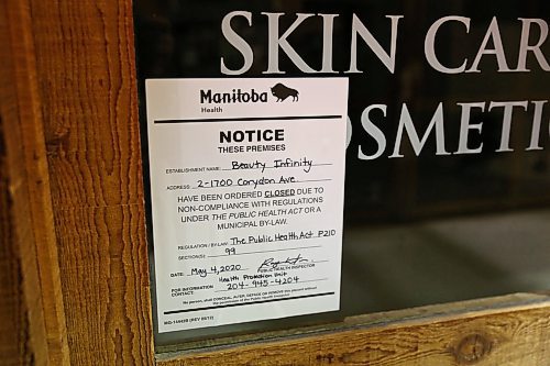 MIKE DEAL / WINNIPEG FREE PRESS

Beauty Infinity, a Corydon Avenue salon, located at 2-1700 Corydon Ave, has a sign on its door for violating public health measures meant to slow the spread of COVID-19.
200511 - Monday, May 11, 2020