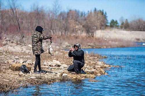 MIKAELA MACKENZIE / WINNIPEG FREE PRESS

Raelynne Cross shows off her first fish of the season (a freshwater drum) while partner Carlos Oliveira takes a picture on the Red River Floodway near Lockport on Monday, May 11, 2020. The season opened up on May 9th. Standup.

Winnipeg Free Press 2020