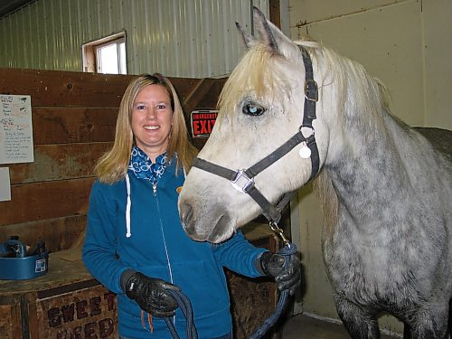 Canstar Community News Oct. 16, 2019 - Urban Stable volunteer Lana Stevenson is shown with one of the Camp Assiniboia horses used in the organization's therapeutic riding work with students in Grades 5 to 8 from schools in Winnipeg, St. Norbert, Oak Bluff, Sanford and Starbuck. (ANDREA GEARY/CANSTAR COMMUNITY NEWS)