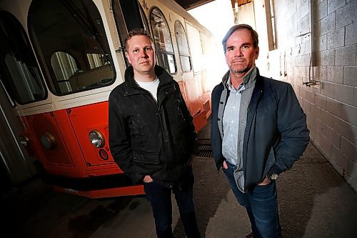 JOHN WOODS / WINNIPEG FREE PRESS
Ben Gillies, left, and Steven Stothers, co-owners of The Winnipeg Trolley Company are photographed with their mothballed tour bus in Winnipeg Monday, May 11, 2020. The Winnipeg Trolley will not be running this summer. COVID-19 distancing requirements mean they cant carry enough passengers to be profitable.

Reporter: Wasney