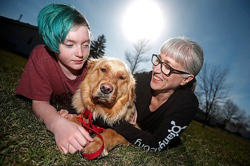 JOHN WOODS / WINNIPEG FREE PRESS
Sunny Szpak-Holly with her child Devon play with their newly adopted dog Mindy, 1.5, in a park close to their home in Winnipeg Tuesday, May 12, 2020. 

Reporter: Zoratti