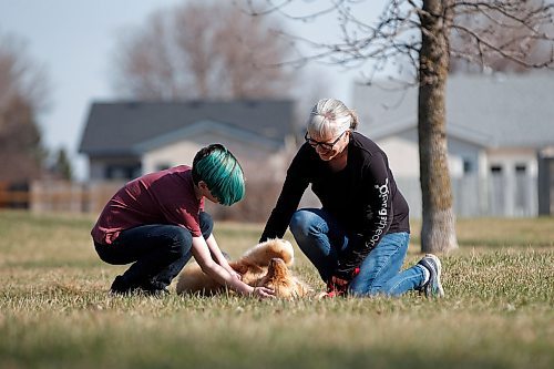 JOHN WOODS / WINNIPEG FREE PRESS
Sunny Szpak-Holly with her child Devon play with their newly adopted dog Mindy, 1.5, in a park close to their home in Winnipeg Tuesday, May 12, 2020. 

Reporter: Zoratti