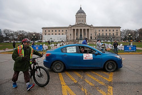 JOHN WOODS / WINNIPEG FREE PRESS
Car drivers and cyclists drove around the legislature honking their horns and ringing their bells in protest to the Manitoba governments recent funding cuts during COVID-19 in Winnipeg Wednesday, May 13, 2020. 

Reporter: Malak