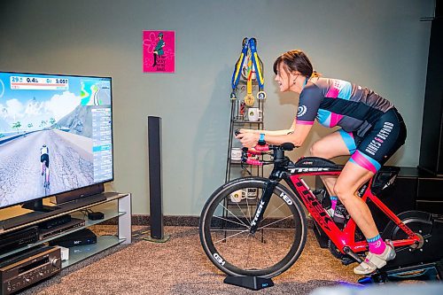 MIKAELA MACKENZIE / WINNIPEG FREE PRESS

Stephanie Roberecki uses her stationary bike and an app called Zwift to keep in shape while staying at home in Winnipeg on Wednesday, May 13, 2020. For Sabrina Carnevale story.

Winnipeg Free Press 2020