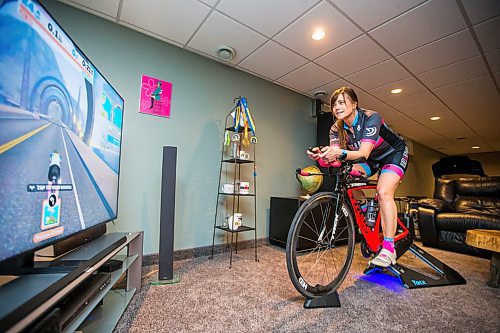 MIKAELA MACKENZIE / WINNIPEG FREE PRESS

Stephanie Roberecki uses her stationary bike and an app called Zwift to keep in shape while staying at home in Winnipeg on Wednesday, May 13, 2020. For Sabrina Carnevale story.

Winnipeg Free Press 2020