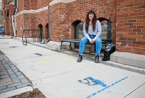 MIKE DEAL / WINNIPEG FREE PRESS
Volunteer Caileigh Morrison at 1JustCity, 365 McGee Street, an organization that operates three drop-in centres in Winnipeg. The group has painted whimsical social distancing markers on the sidewalk outside the drop-in centre.
200514 - Thursday, May 14, 2020.