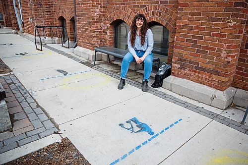 MIKE DEAL / WINNIPEG FREE PRESS
Volunteer Caileigh Morrison at 1JustCity, 365 McGee Street, an organization that operates three drop-in centres in Winnipeg. The group has painted whimsical social distancing markers on the sidewalk outside the drop-in centre.
200514 - Thursday, May 14, 2020.