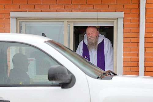 RUTH BONNEVILLE / WINNIPEG FREE PRESS

Local Standup - Confessional Window

Father David Kowalski of St. Theresa's Roman Catholic Church in West Saint Paul, chats with one of his long-time parishioners through his newly installed confessional window prior to opening the drive-thru confessional onThursday.  Father Kowalski has been operating the drive-thru since April 1st from a heated trailer in the parking lot  but now as a newly installed confessional window that was cut into the wall of the church last week and can be accessed from inside the church.  The drive thru confessional is open Thursday, Friday Saturday from 4 - 5 pm and by appointment.  

May 14, 2020