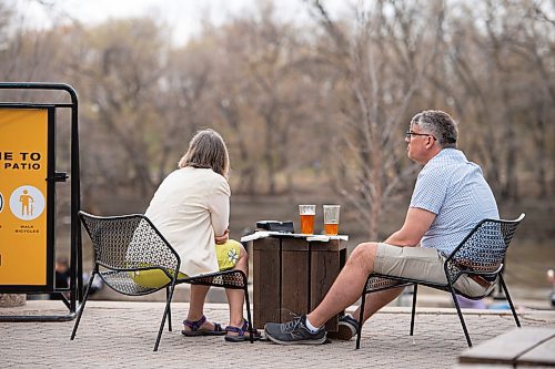 Mike Sudoma / Winnipeg Free Press
A couple enjoy a beer on the patio at The Forks Saturday afternoon
May 16, 2020