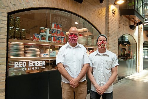 Mike Sudoma / Winnipeg Free Press
Red Ember owners Stefan Zin (left) and Quinn Ferguson (right) are happy about the re-opening of their restaurant located inside of the Forks Market Saturday afternoon
May 16, 2020