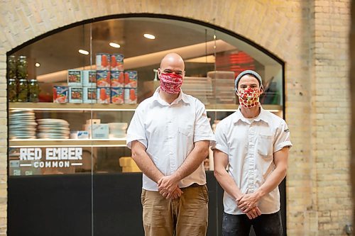 Mike Sudoma / Winnipeg Free Press
Red Ember owners Stefan Zin (left) and Quinn Ferguson (right) are happy about the re-opening of their restaurant located inside of the Forks Market Saturday afternoon
May 16, 2020