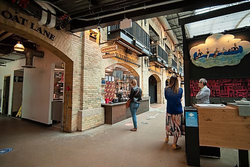 Mike Sudoma / Winnipeg Free Press
A customer waits for their order at Weinerpeg inside of The Forks Market Saturday afternoon
May 16, 2020