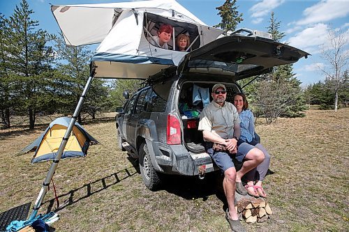 JOHN WOODS / WINNIPEG FREE PRESS
Kaitlan Knowles and Steve Pratt are photographed with children Ginny, left, and Madeline hang out in their tent when they were out enjoying some camping this weekend in Birds Hill Park just north of Winnipeg Sunday, May 17, 2020. 

Reporter: Waldman