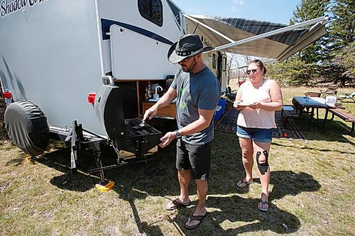 JOHN WOODS / WINNIPEG FREE PRESS
Whitney Brault and Jason Zarecki get the BBQ ready for some grilling when they were out enjoying a week of camping in Birds Hill Park just north of Winnipeg Sunday, May 17, 2020. 

Reporter: Waldman