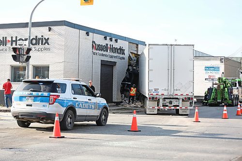 MIKE DEAL / WINNIPEG FREE PRESS
The cab of a semi-truck came to rest inside the Russell Hendrix restaurant supply store at Erin Street and Ellis Avenue after being in a collision with a car early Wednesday morning. 
200520 - Wednesday, May 20, 2020