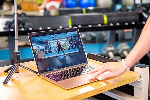 MIKAELA MACKENZIE / WINNIPEG FREE PRESS

Kathryn Dzikowicz shows one of her home workout videos in her gym, Blue Sky Fitness, in Winnipeg on Wednesday, May 20, 2020. For JS story.
Winnipeg Free Press 2020.