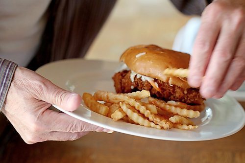 SHANNON VANRAES / WINNIPEG FREE PRESS
Crinkle fries compliment a chicken sando from Mercy Me Nashville Chicken on May 20, 2020.
