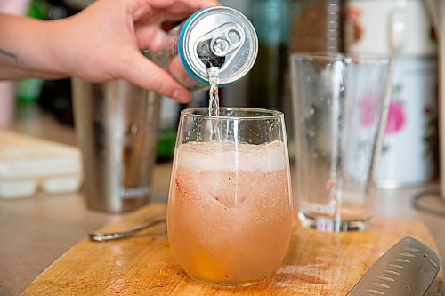 Mike Sudoma / Winnipeg Free Press
Elsa Taylor, head bartender and co-owner of The Roost, pours out her finished Gin and Soda in her apartment Saturday afternoon