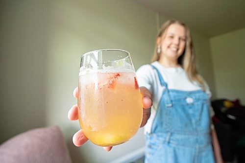 Mike Sudoma / Winnipeg Free Press
Head Bartender and Co-owner of the Roost, Elsa Taylor, shows off her take on a classic gin and soda which she fittingly calls the amped up gin and soda in her apartment Saturday afternoon
May 23, 2020