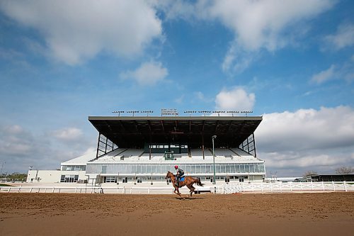 JOHN WOODS / WINNIPEG FREE PRESS
A rider is photographed training at the track at Assiniboia Downs Sunday, May 24, 2020. The Downs is opening their race season tomorrow with an empty grandstand. The races will be televised and online.


Reporter: Allen
