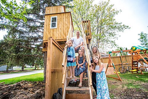 MIKAELA MACKENZIE / WINNIPEG FREE PRESS

Paul Bilodeau (top stairs), Ella Bilodeau (five, second from top stairs), Maya Bilodeau (nine, bottom of stairs), Whitney Campbell (top right), and Annie Pollmann (nine, bottom right) pose for a portrait by their elaborate treehouse in Winnipeg on Monday, May 25, 2020. For Al Small story.
Winnipeg Free Press 2020.