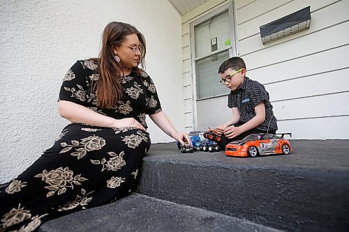 JOHN WOODS / WINNIPEG FREE PRESS
Marika Schalla, a teacher with the Winnipeg School Division, and her son Declan, 7, who have been at home due to COVID-19 are photographed on their front steps Tuesday, May 26, 2020. Both may be returning to class next month.

Reporter: Macintosh