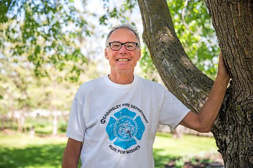 MIKAELA MACKENZIE / WINNIPEG FREE PRESS

Glenn Reimer, deputy chief for EMS, Headingley Fire Department and race organizer for Run for Wishes, poses for a portrait in his front yard in Headingley on Wednesday, May 27, 2020. For Brenda Suderman Sunday Special story.
Winnipeg Free Press 2020.