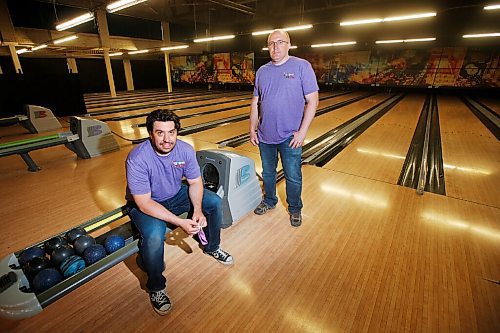 JOHN WOODS / WINNIPEG FREE PRESS
Nathan Hogg, manager, left, and Todd needs a haircut Britton, co-owner of Uptown Alley, photographed in their bowling alley Wednesday, May 27, 2020. They will be closing every second lane and will have physical distancing signage on their screens when they open.

Reporter: Sanders