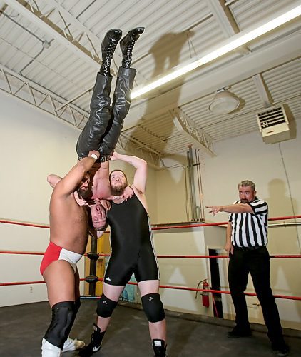 SHANNON VANRAES / WINNIPEG FREE PRESS
Wrestlers Danny Warren and Adrien Burton prepare to vanquish Kevin Cannon as referee Mike Wiseman looks on, on May 27, 2020.